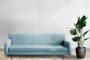 Free-PSD-_-Wall-mockup-psd-with-blue-sofa-in-living-room-625x438